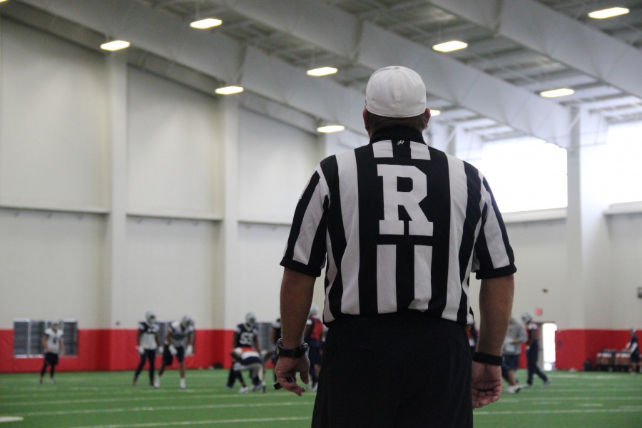 A referee looks on as the Dallas Cowboys practice in Coppells field house. Photo by Mallorie Munoz.