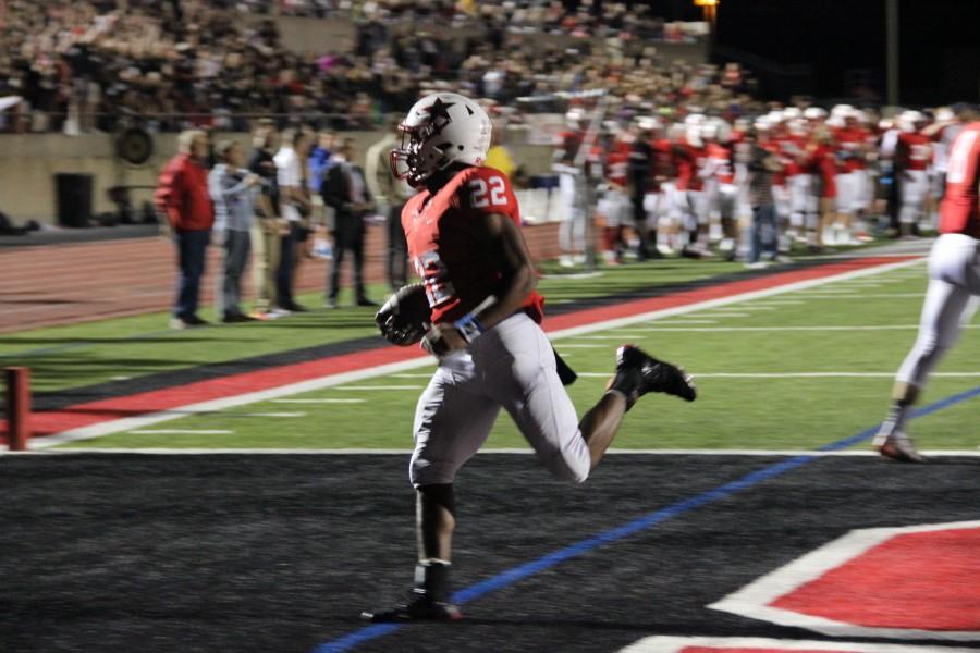 Coppell+High+School+senior+running+back+Brandon+Rice+runs+across+the+end+zone+scoring+a+touchdown+for+the+Cowboys.+After+a+long+game+at+Buddy+Echols+Field+the+Southlake+Dragons+take+home+the+win+38-37.+Photo+by+Megan+Winkle.