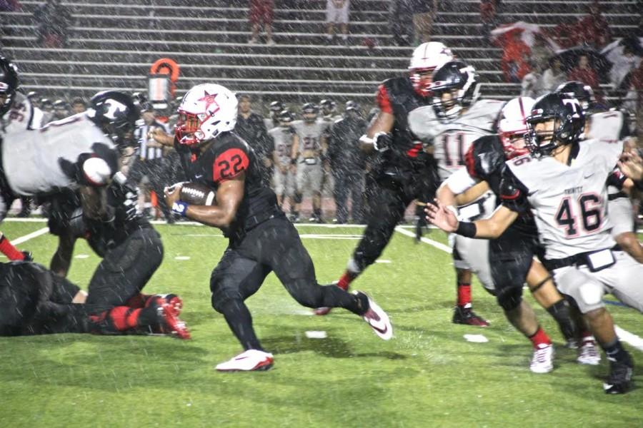 Coppell+High+School+senior+running+back+Brandon+Rice+runs+the+ball+through+Trinitys+defense+Friday+Night+at+Buddy+Echols+Field.+On+Friday+night%2C+the+Cowboys+lost+to+Trinity%2C+with+a+final+score+of+49-14.+Photo+by+Ale+Ceniceros.%0A