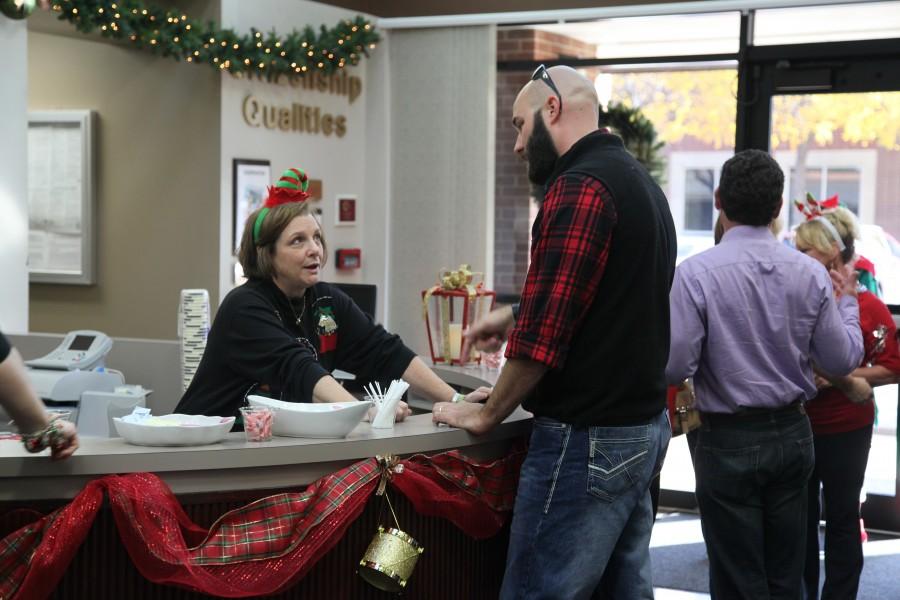 The Holiday Open House is held at the Vonita White Administration building on Dec. 11 from 9 a.m. to 3 p.m. to show staff appreciation. Holiday entertainment from school choirs, a photo booth and holiday snacks were available. Photo by Aubrie Sisk. 