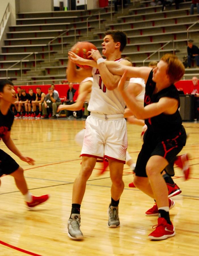 Marcus High School junior shooting guard Jake Watermiller tries to find a pass against Coppell High School. The Marauders defeated the Cowboys Tuesday night at Marcus High School, 54-40.
