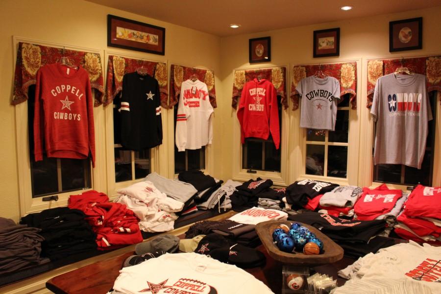 Coppell spiritwear from Spirit Round-Up is sold at Laura Swaldi’s annual holiday show on Dec. 8. The event was held at her house and holiday presents were available for purchase such as jewelry, men’s gifts, and snacks. Photo by Kelly Monaghan.