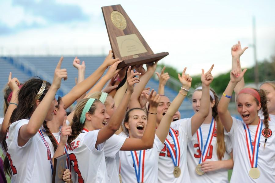 The+Coppell+Cowgirls+soccer+team+celebrates+after+defeating+Cinco+Ranch+to+win+the+2014-2015+6A+State+Championship.