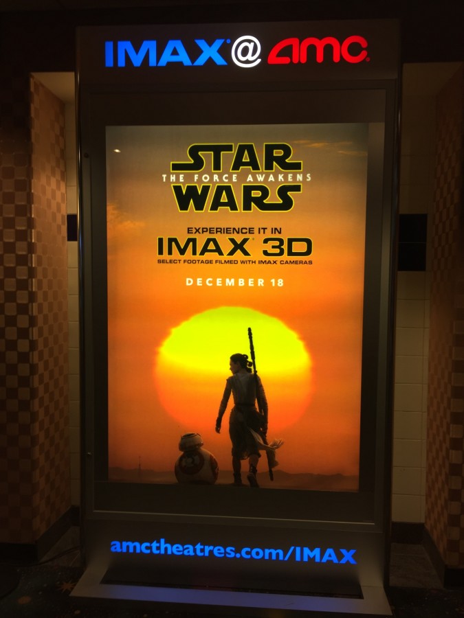 A poster for the new Star Wars movie, Star Wars: The Force Awakens is displayed at the AMC Theatres in Grapevine Mills Mall. The seventh film in the series was released on Dec. 18 and featured characters from the original trilogy such as Luke Skywalker and Han Solo. Photo by Kelly Monaghan. 
