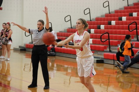 Coppell High School sophomore shooting Guard Mary Luckett passes the ball during the game at home in the large gym on Tuesday. The Lady Raiders defeated the Cowgirls, 39-26. 