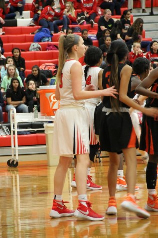 Coppell High School junior Abigail Johnson defends while the Haltom player attempts to score in the first quarter of Friday night’s game in the CHS large gym. The Cowgirls lost to the Lady Buffalo with a final score of 43-35.