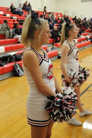 Coppell High School sophomore varsity cheerleader Avery Zaves cheers on the Cowgirls basketball team Friday night at Coppell High School. The game ended with the Haltom Lady Buffalo defeating the Coppell Cowgirls 43-35. 