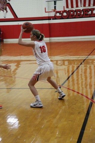 During the second quarter of Friday night’s game, Coppell High School sophomore Mary Luckett looks to pass the ball in the CHS large gym. Coppell ended the game with a score of 43-35, loosing to Haltom. 