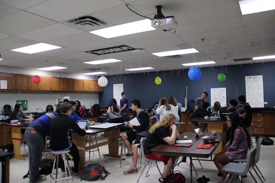 Students in Dayna Bryants AP GT Physics I class work on their group projects on circular motion during fifth period in room C102 on Tuesday. After performing their lab procedures, the students are expected to  document their steps for the formal lab reports. Photo by Ayoung Jo