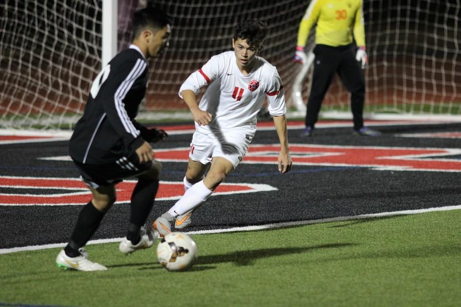 Coppell High School junior forward Nicholas Taylor steals the ball away from the opposing Haltom player on Tuesday night at Buddy Echols Field. Taylor scored multiple goals that contributed to Coppell’s 11-3 win over Haltom. 