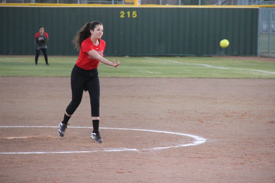 Coppell High School freshman Emily Heffernan pitches the ball the opponent team player. Coppell JV II scrimmaged against Allen at the Coppell ISD baseball/softball complex
on Monday.
