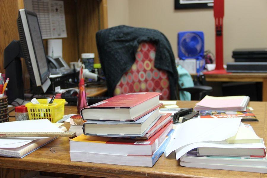 The+librarians+have+much+to+deal+with+as+clutter+piles+up+on+their+desks.