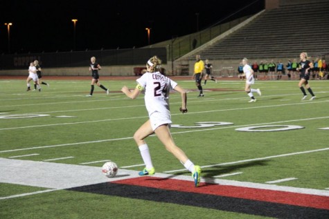 Coppell High School senior Emma Jett dribbles the ball down the field on Friday. The Coppell Cowgirls lost to Southlake Carroll, 3-0, at Buddy Echols Field.
