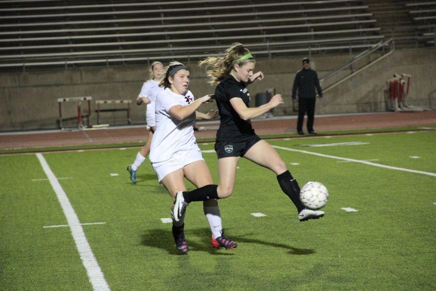 Coppell High School senior Ashleigh Little tries to steal the ball away from a Southlake Carroll on Friday. The Coppell Cowgirls lost to Southlake Carroll, 3-0, at Buddy Echols Field.