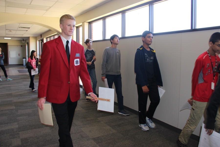 Coppell High School senior Red Jacket Alan Ritchie leads a tour of CMSN eighth graders around Coppell High School on Feb. 2. Every year, eighth graders from each of the three Coppell middle schools tour CHS.