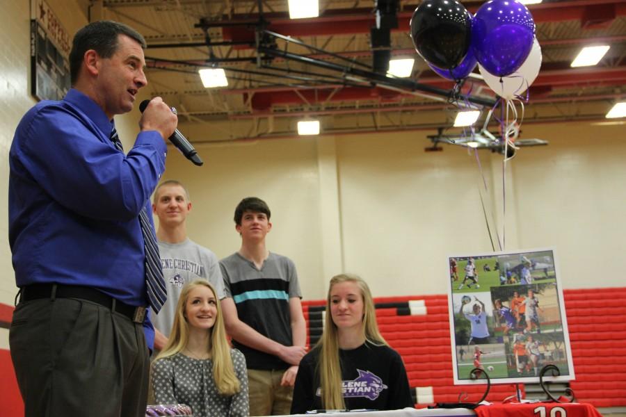 Former+Coppell+Cowgirl+soccer+coach+Chris+Stricker+talks+to+the+crowd+about+Shay+Johnson+at+signing+day.+Johnson+signed+with+Abilene+Christian+University+to+play+soccer.+Photo+by+Mallorie+Munoz.