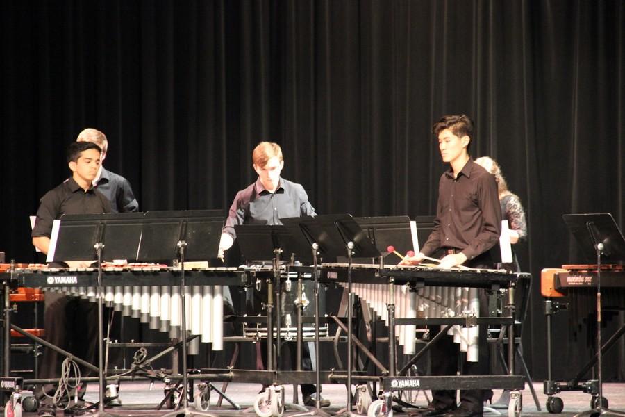Coppell High School junior Maanas Sathaye, seniors Ethan Judd and Kevin Yuan perform a piece named “Trio Per Uno” by Neboja Zivkovic during the Purely show in the auditorium on Thursday. Sathaye, Judd and Yuan are all in the Coppell High School drumline, which received first place in the Percussive Arts Society International Marching Festival earlier this year.