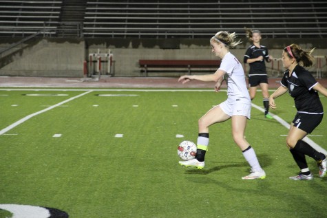 Coppell senior Shay Johnson dribbled down the field on senior night against Haltom. The Cowgirls scored seven goals in the first half to ease to a 12-0 win to end the regular season. Photo by Ayoung Jo.