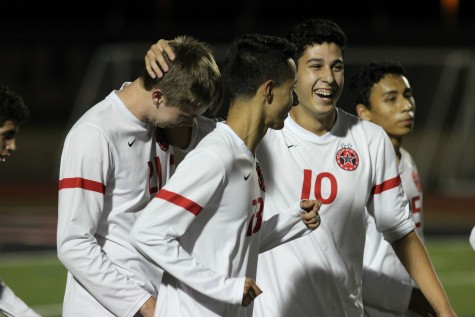 Cowboys soccer players celebrate after one of their nine goals in their 9-0 victory over Richland at Home. With this win, Coppell moves to 14-0-2 on the season.