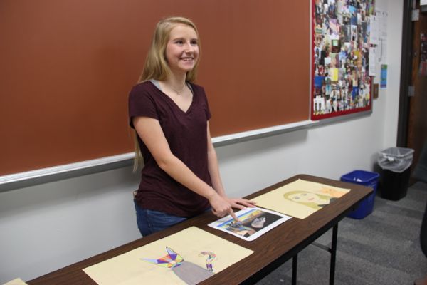 Coppell High School sophomore Venla Kuvaja displays her artwork to her classmates and teacher on Tuesday. All Honors Spanish III classes are creating artwork and some are being displayed at Slant gallery in 13331 Preston Road, #2218 Dallas, TX.
