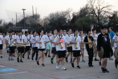 Coppell High School marching band practices behind Buddy Echols Field on Feb. 29. The band practices Monday and Friday after school before Spring Break to be prepared for the 15th annual Saint Patrick’s Day parade in London. 