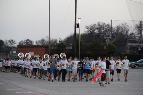 The Coppell High School Band practices keeping straight lines as they march around the CHS parking lot on Feb. 29. The band practices Monday and Friday after school before Spring Break to be prepared for the 15th annual Saint Patrick’s Day parade in London. 