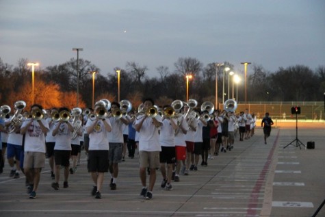 Coppell High School marching band practices playing songs and walking in formation on Feb. 29. The band practices Monday and Friday after school before Spring Break to be prepared for the 15th annual Saint Patrick’s Day parade in London. 