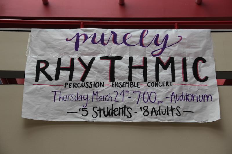 A sign on the senior bridge advertises the upcoming percussion ensemble concert, Purely Rhythmic. The CHS percussion members will perform in the auditorium this Thursday at 7 p.m. Photo by Kelly Monaghan.