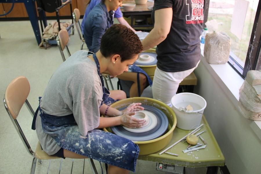  Coppell High School senior Katherine Yut begins to sculpt a cup in Tamera Westervelt’s Sculpture/AP 3D Design class on Wednesday. After students mold cups they then begin to make the handles and lid.