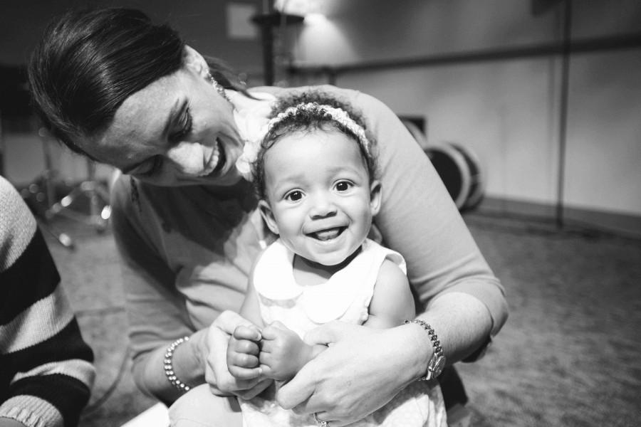 YoungLives leader and volunteer Heather D. plays with one of the babies while the mother gets a much-needed break. Heather is a mentor, a volunteer who supports the teen moms in the program and offers them guidance on matters ranging from parenting to their Christian faith.