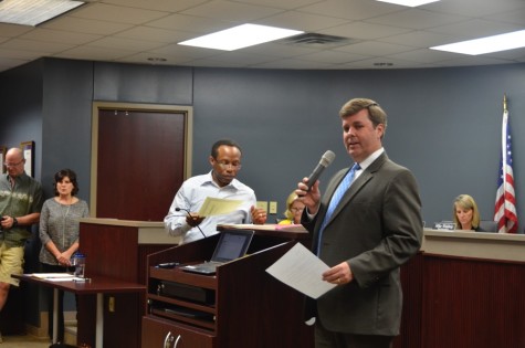 Coppell Independent School District school board president David Apple introduces the National Merit finalists from both Coppell high schools on Monday at the Vonita White Administration Building. Coppell High School has 36 winners and New Tech High@Coppell has one. Photo by Jennifer Su.