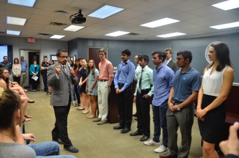 Coppell High School Principal Mike Jasso recognizes all 36 of the Coppell High School National Merit finalists on Monday at the Vonita White Administration Building. This is a record number of National Merit finalists for the history of Coppell High School. Photo by Jennifer Su.