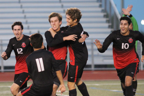 After Coppell’s third goal of the night is scored by Coppell High School junior Nick Taylor, the Cowboys celebrate as the second half of Tuesday night's game begins. The Coppell Cowboys defeated the McKinney Boyd Broncos 4-1, resulting in their advancement to regional semifinals. 