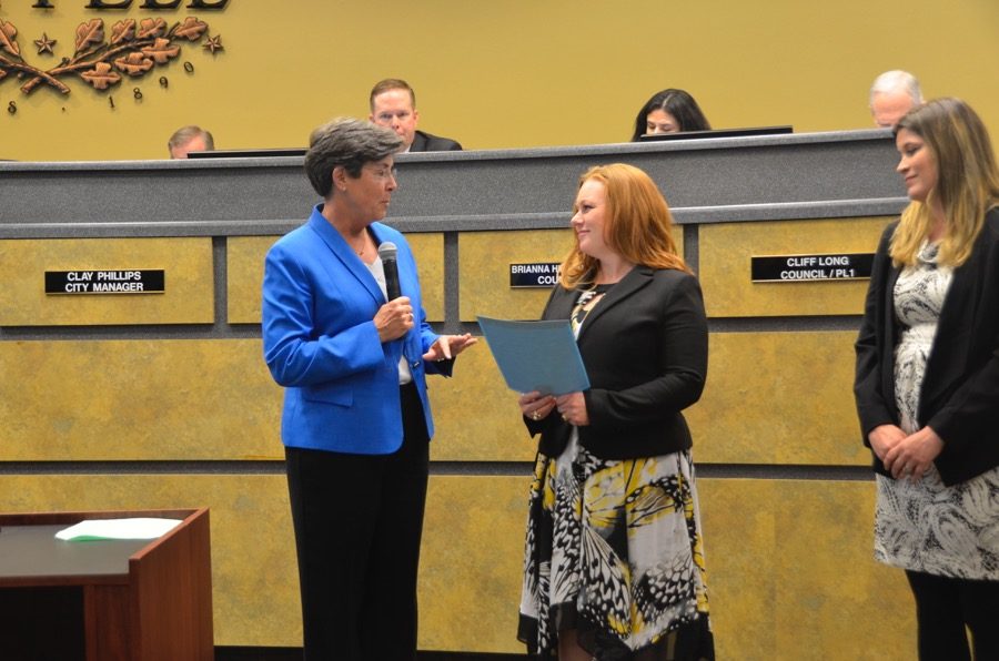 Coppell mayor Karen Hunt proclaims the month of April as “Monarch Migration Awareness Month” on Tuesday at Coppell City Hall. Hunt emphasizes that “every citizen of Coppell can make a difference for the monarch by planting native milkweed and nectar plants to provide habitat for the monarch and pollinators in locations where people live, work, learn, and play.” Photo by Jennifer Su. 