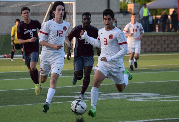 Coppell High School senior Rodrigo Zuniga dribbles down the field  at the end of the second half on Friday night’s match at Birkelbach Field in Georgetown. The Cowboys continue their undefeated season with a 1-0 win in the Class 6A state semifinals against Cinco Ranch. 
