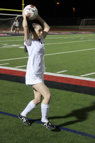 Coppell High School senior Madeline Guderian throws in the ball during the game against Allen.The Cowgirls lost to the Lady Eagles on Friday night at Buddy Echols Field with a score of 2-3. Photo by Megan Winkle.