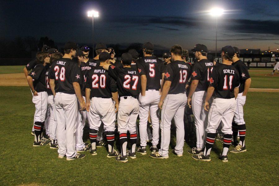 The+Coppell+High+School+varsity+baseball+team+huddles+after+its+game+against+Richland.+