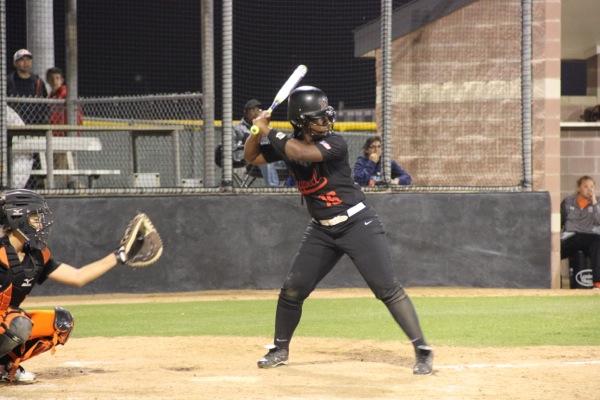 Coppell High School senior Autumn Redmon bats during Tuesday night’s game against Haltom High School at the Coppell ISD Baseball/Softball Complex. The Cowgirls won at the end of the fifth inning with a score of 10-0. 