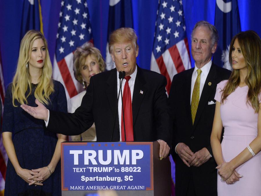 Republican presidential candidate Donald Trump, flanked by his daughter Ivanka, left, and his wife Melania Trump, speaks during a primary watch party at the Spartanburg Marriott on Feb. 20, 2016 in Spartanburg, S.C. (Olivier Douliery/Abaca Press/TNS)