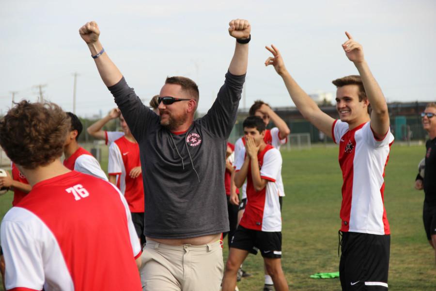Athletic+trainer+Barry+Jones+and+junior+defender+Laurence+Fairchild+celebrate+after+Jones+puts+a+penalty+kick+into+the+upper+90+over+the+goalkeeper.+After+the+six+hour+trip+to+Midland%2C+the+Cowboys+stopped+for+a+quick+training+session+before+their+game+on+Friday+at+4+p.m.