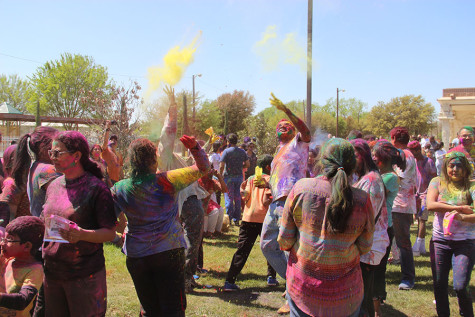 Holi attendees dance to traditional music at the DFW Hindu Temple on Sunday. According to The Society for the Confluence of Festivals in India, “on this day people do not differentiate between the rich and poor and everybody celebrate the festival together with a spirit of bonhomie and brotherhood. In the evening people visit friends and relatives and exchange gifts, sweets and greetings. This helps in revitalizing relationships and strengthening emotional bonds between people.” 