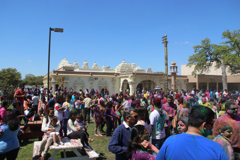 Holi attendees dance to traditional music at the DFW Hindu Temple on Sunday. According to The Society for the Confluence of Festivals in India, “on this day people do not differentiate between the rich and poor and everybody celebrate the festival together with a spirit of bonhomie and brotherhood. In the evening people visit friends and relatives and exchange gifts, sweets and greetings. This helps in revitalizing relationships and strengthening emotional bonds between people.”