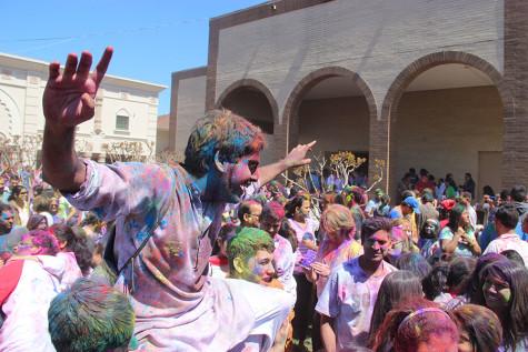 Holi attendee crowd surfs at the DFW Hindu Temple on Sunday. According to India Celebrating, “Traditionally, Holi is celebrated to get success over the evil power or badness of goodness. It is named as ‘Phagwah’, as it is celebrated in the Hindi month, Phalgun.” 