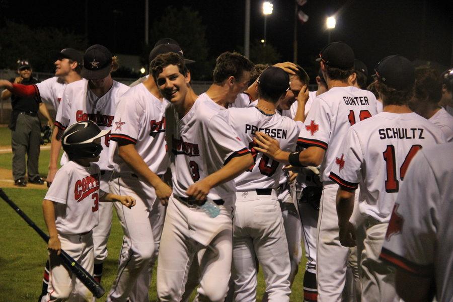 The Cowboys celebrate as Trey Becerra strokes a grand slam over the left field wall which increased their lead to 12-0 in the fourth inning of the second game of Wednesday night’s doubleheader against the Haltom Buffalos. The Cowboys played at the Coppell ISD Baseball/Softball Complex and the night ended with a 10-0 win in the first game and the second game ending 12-1.