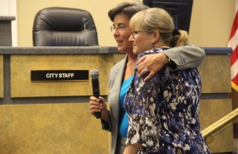 Coppell Mayor Karen Hunt hugs newly retired Community Information Officer Sharon Logan after the announcement of the day of appreciation dedicated to her.