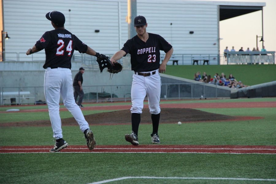 Coppell High School senior infielder Marco Navarro high fives senior pitcher Ray Gaither after recording a third inning strikeout on Friday. Cowboys beat the Jaguars 1-0 at QuickTrip Park in Grand Prairie during the Class 6A Region I quarterfinal.
