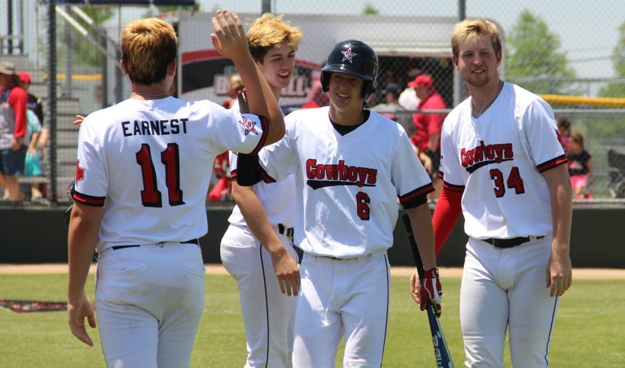 The Coppell High School varsity baseball team celebrates its win against Duncanville High School on Saturday at the Coppell ISD Baseball/Softball Complex. The Cowboys swept the Panthers, 7-0, advancing to the second round of the playoffs. Photo by Ale Ceniceros.