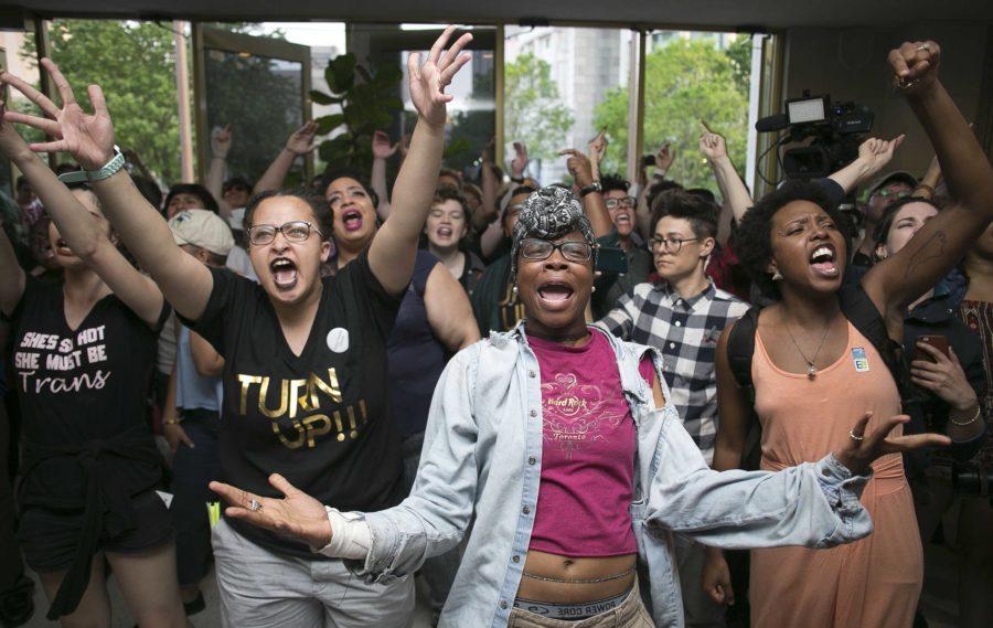 Krys Didtrey, left, and Gloria Merriweather, center, of Charlotte, N.C., lead chants in opposition to HB2 during a protest in the lobby of the State Legislative Building in Raleigh, N.C., on Monday, April 25, 2016. A large group of people starting chanting in the lobby moment after the House adjourned for the evening. (Robert Willett/Raleigh News & Observer/TNS)
