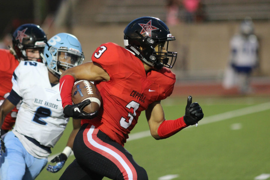 During Friday nights game, Coppell High School sophomore and free safety Jonathan McGill runs the ball down the field as the first quarter comes to a close at Buddy Echols Field. The Coppell Cowboys ended the night with a 28-21 victory over L.D. Bell. Photo by Amanda Hair.