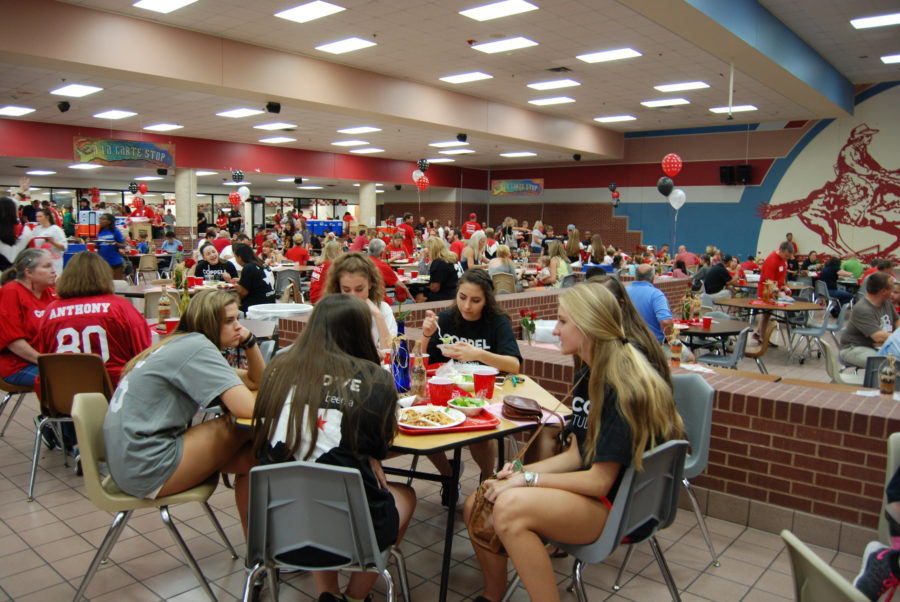 Coppell students, families and community members enjoy their meal at the 23rd annual Lariette Spaghetti Dinner. More than $26,000 was raised from the dinner tickets, bake sale, raffle and auction, with all funds going towards future expenses of the Lariettes for the 2016-17 school year. 